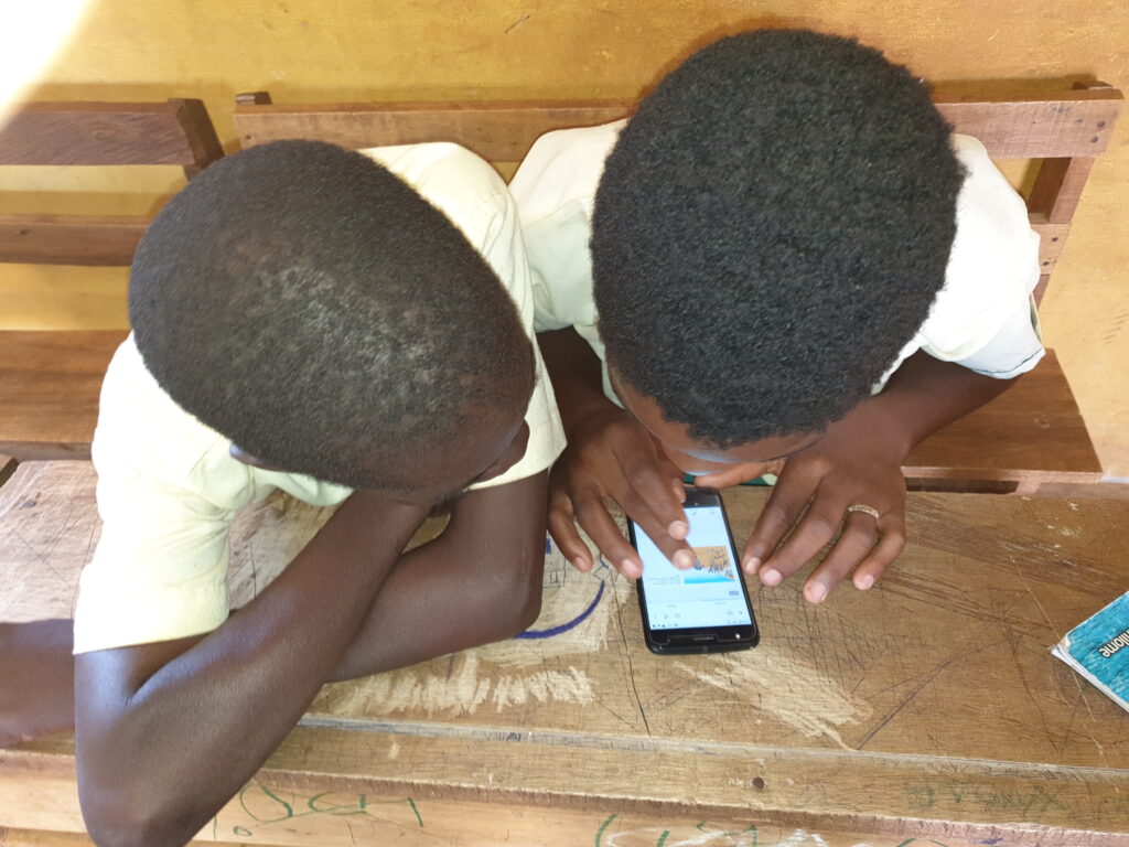 Boys reading on smartphone